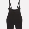 Shapewear bodysuit med öppen byst och längd till mitten av låret