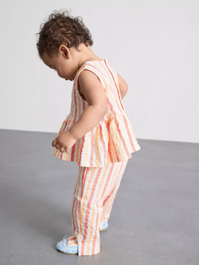 0–36 månader | Set med randig peplum-top och byxor
