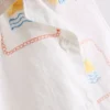 1,5–9 år | broderat set med ärmlös skjorta och shorts