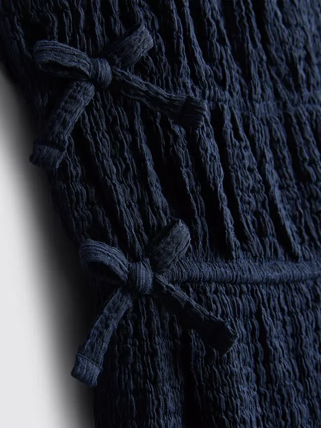 1,5–9 år | jumpsuit med rosett