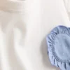 1,5–9 år | Set med volang-T-shirt och byxor