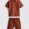 1–9 år | Set med strukturerad polotröja och shorts