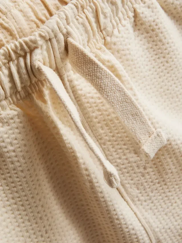 1–9 år | Set med strukturerad polotröja och shorts
