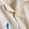 7–15 år | broderad skjorta med knappar