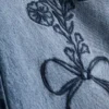 7–15 år | Jeans med breda ben och broderad blommig rosett