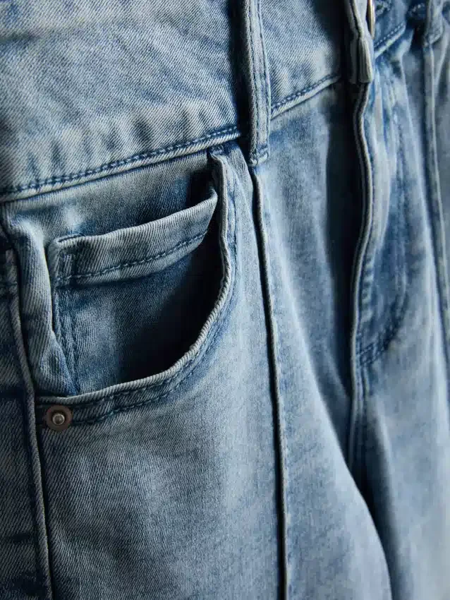 7–15 år | Jeans med veck och utsvängda ben