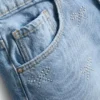 7–15 år | jeansshorts med strassrosett