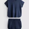 7–15 år | Set med boxig T-shirt och löparshorts