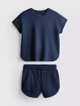 7–15 år | Set med boxig T-shirt och löparshorts