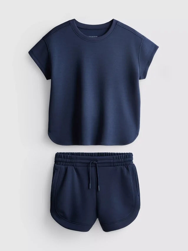 7–15 år | Set med boxig T-shirt och löparshorts