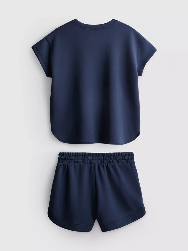 7–15 år | Set med boxig T-shirt och löparshorts