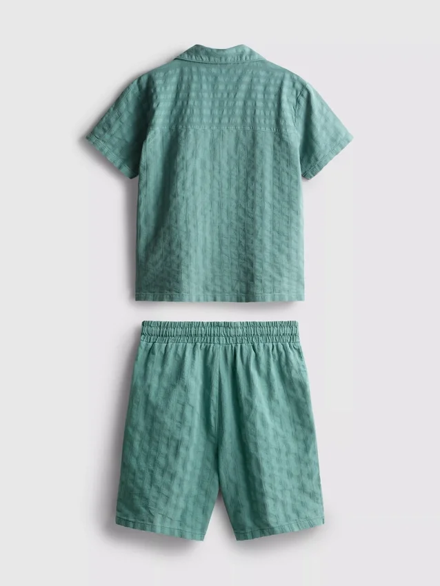 7–15 år | Set med kortärmad knäppskjorta och shorts i texturerat tyg
