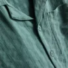 7–15 år | Set med kortärmad knäppskjorta och shorts i texturerat tyg