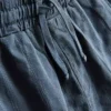 7–15 år | Set med kortärmad knäppskjorta och shorts i texturerat tyg