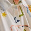 7–15 år | Set med skjorta och shorts med knytdetalj