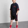7–15 år | Set med T-shirt och shorts i aktivt nätmaterial