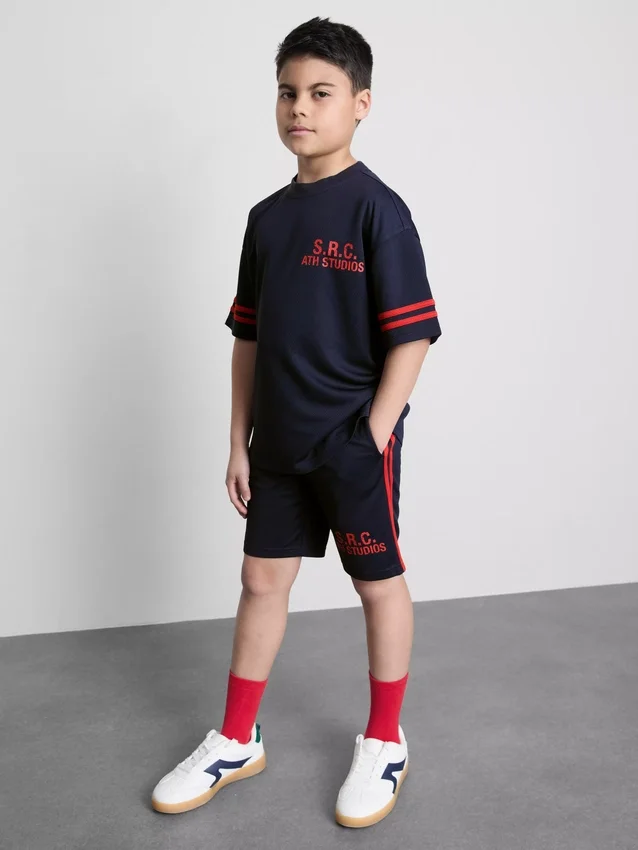 7–15 år | Set med T-shirt och shorts i aktivt nätmaterial