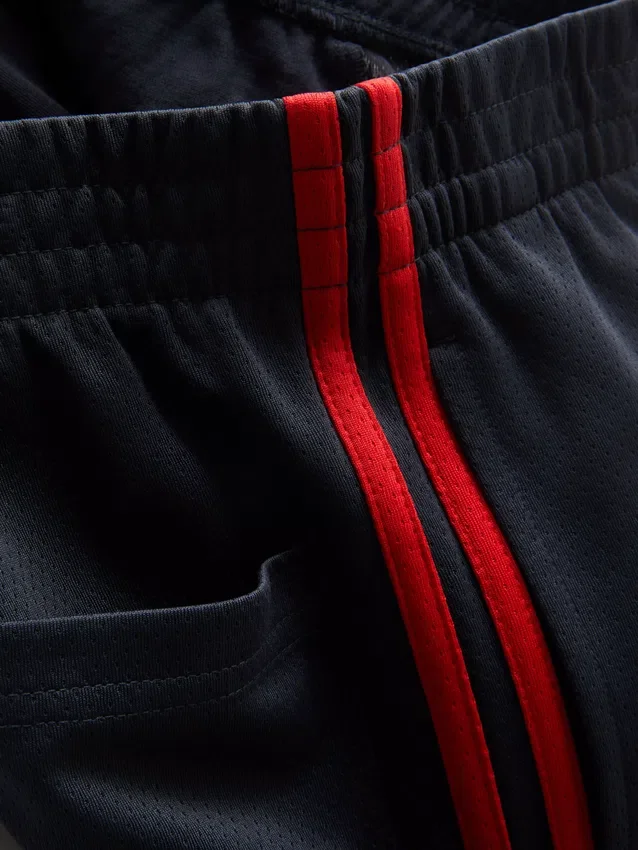 7–15 år | Set med T-shirt och shorts i aktivt nätmaterial