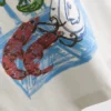 7–15 år | T-shirt i oversized-modell med grafiskt tryck