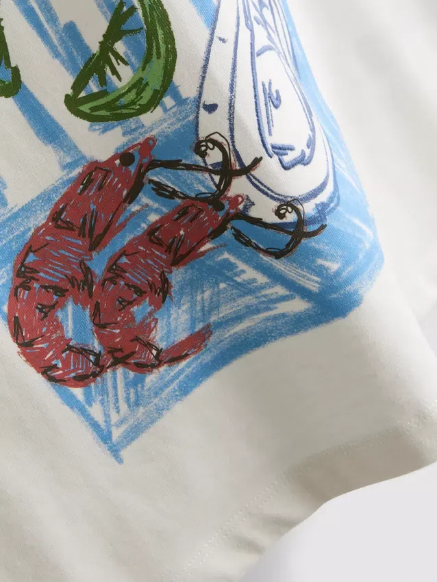 7–15 år | T-shirt i oversized-modell med grafiskt tryck