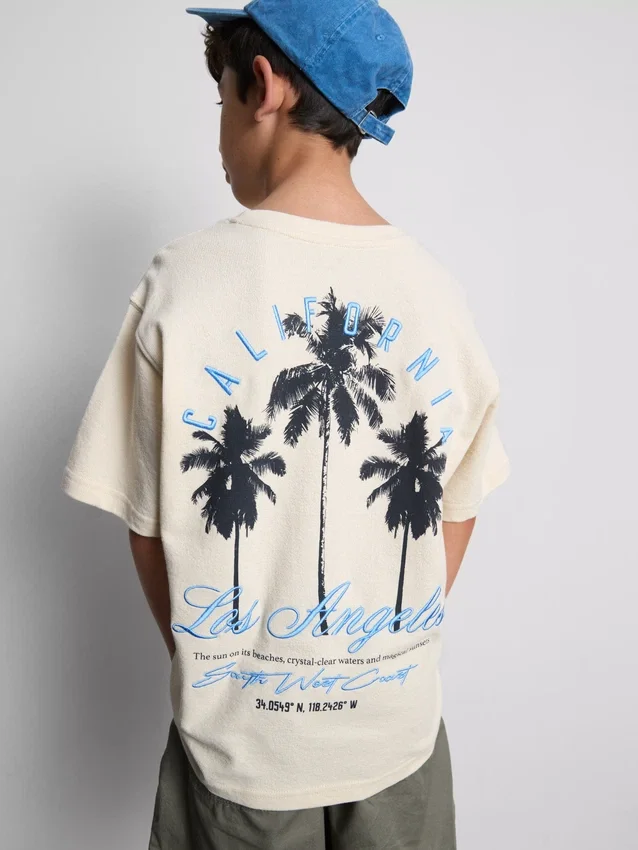 7–15 år | T-shirt med palmmotiv och struktur