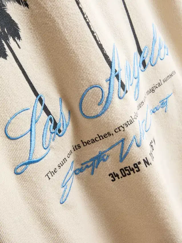 7–15 år | T-shirt med palmmotiv och struktur