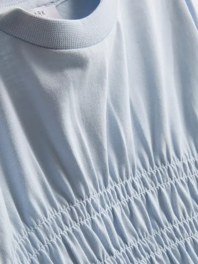 7–15 år | T-shirt med rynkad peplum
