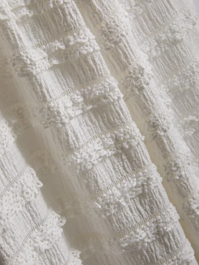 7–15 år | texturerade byxor med vida ben
