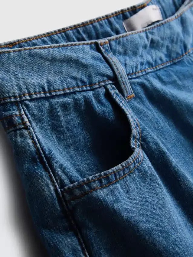 Asymmetrisk skort i bomullsdenim