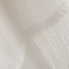 Asymmetrisk T-shirt i bomull med fransar