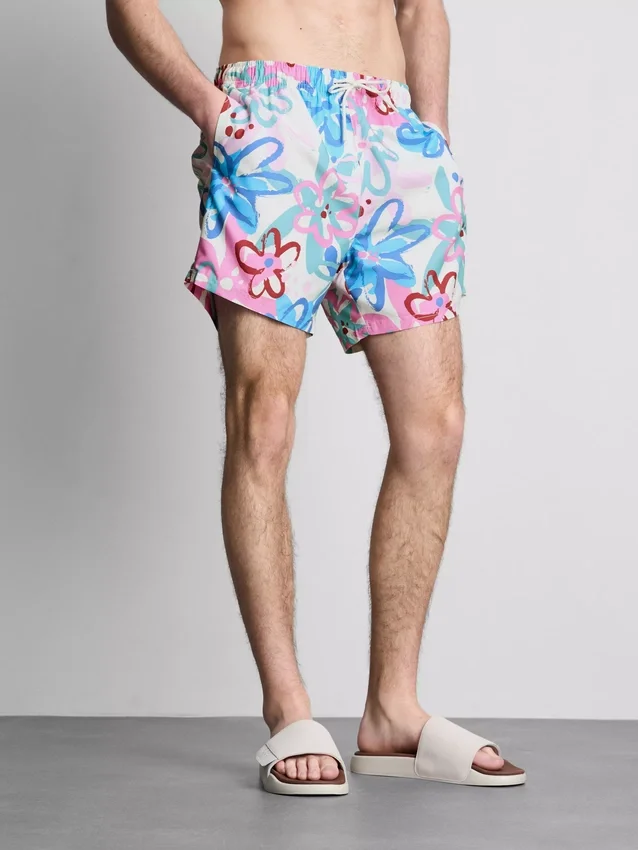 Badshorts med blommigt graffitimönster