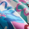 Badshorts med blommigt graffitimönster