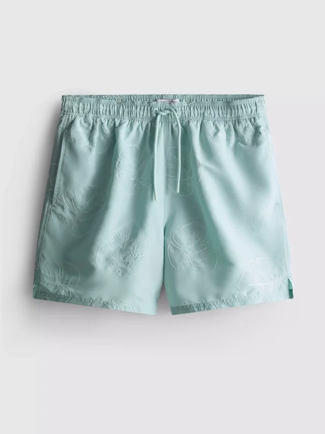 Badshorts med broderade löv