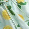 Badshorts med citronmönster
