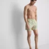 Badshorts med palmträdsmönster