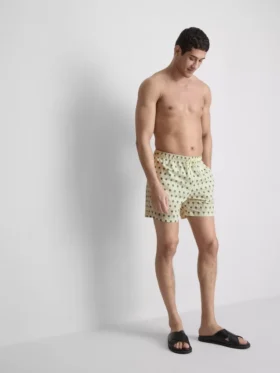 Badshorts med palmträdsmönster