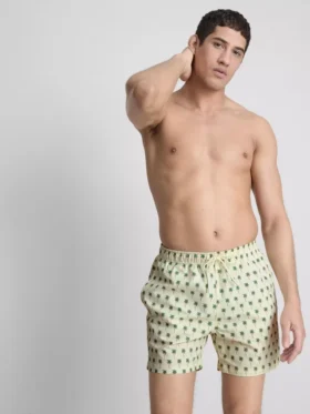 Badshorts med palmträdsmönster