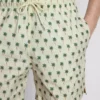 Badshorts med palmträdsmönster