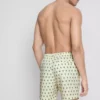 Badshorts med palmträdsmönster