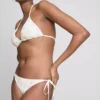 Bikinibottnar med broderat yttertyg och knytband i sidan