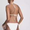 Bikinibottnar med broderat yttertyg och knytband i sidan