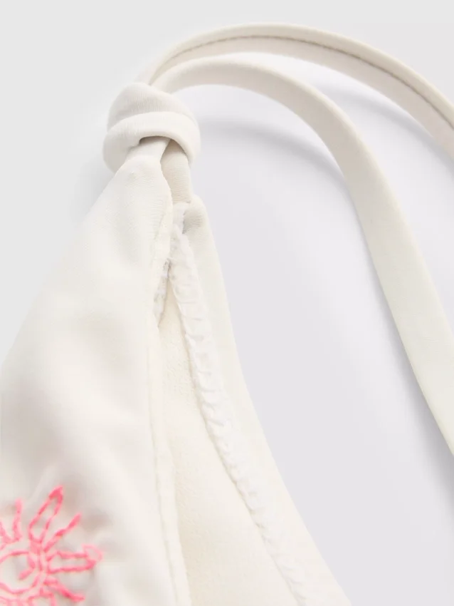 Bikinibottnar med broderat yttertyg och knytband i sidan