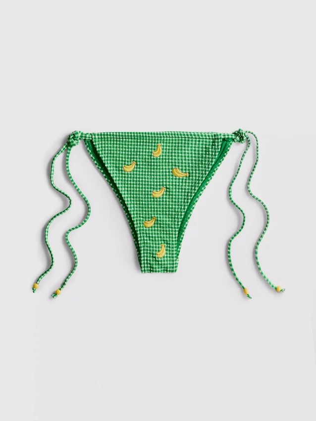 Bikinitrosor i rutigt tyg med knytband i sidan