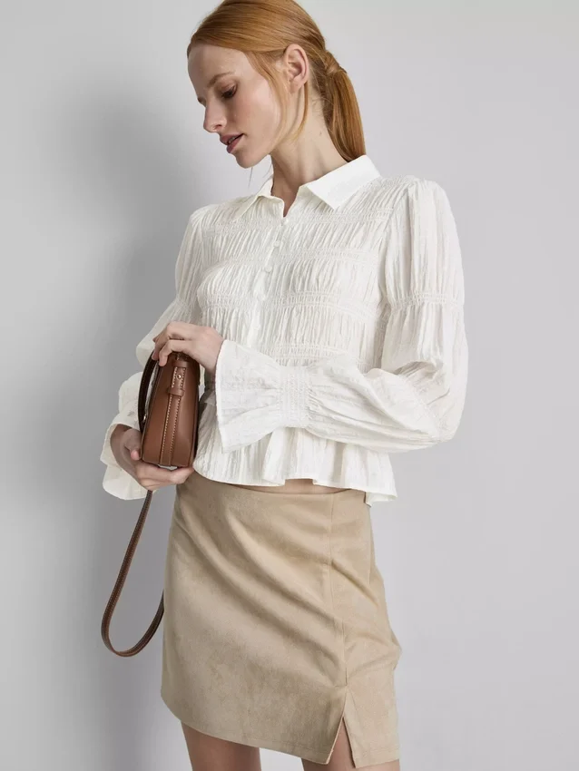 Blus med rynkad peplum-nedkant