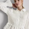 Blus med rynkad peplum-nedkant