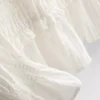 Blus med rynkad peplum-nedkant