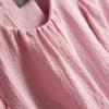 Blus med strukturerade ballongärmar