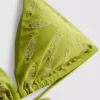 Broderad bikinitopp med fiskmotiv i triangulär modell