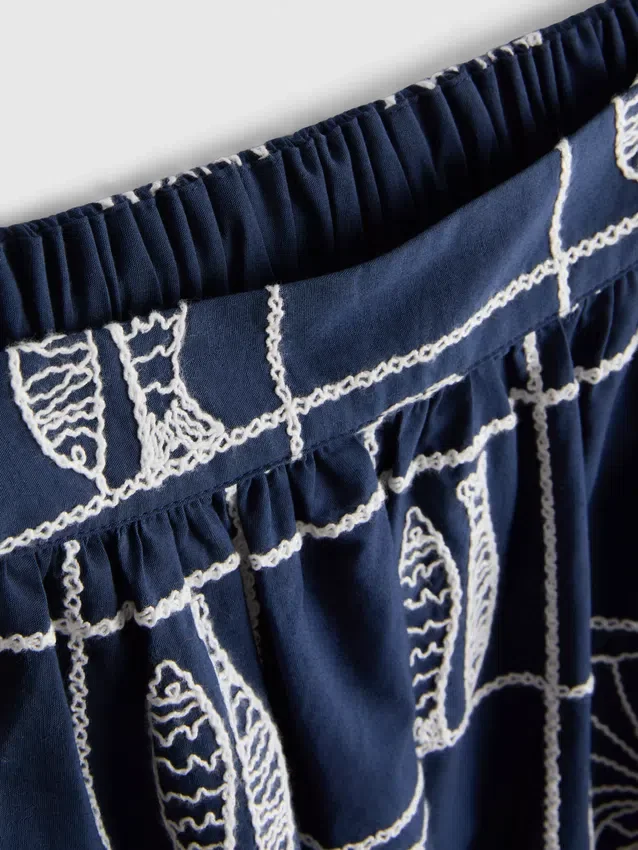 Broderad midikjol i A-linjeform av bomull