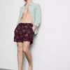 Broderade badshorts med palmträd